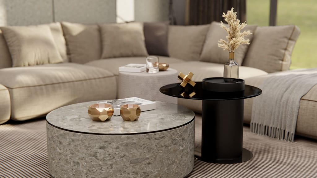 Table basse ronde effet pierre grise à éclats dans un salon aux tons beiges