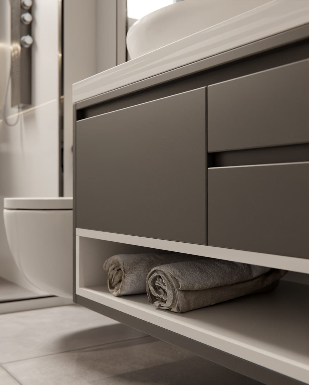 Meuble vasque suspendu aux façades de tiroirs brun taupe mat, niche blanche avec serviettes roulées